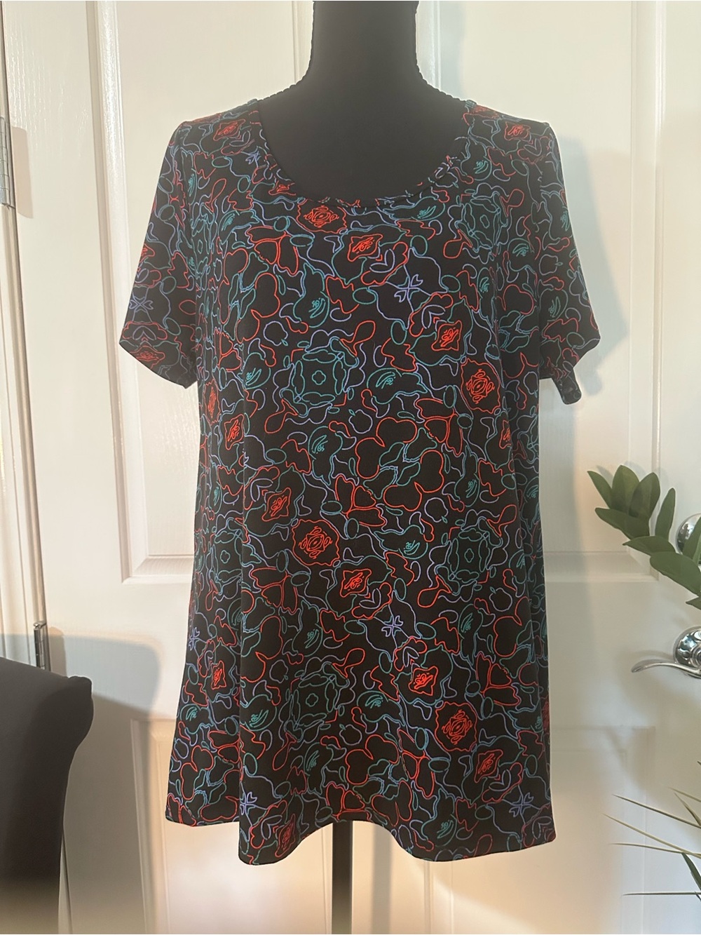 LuLaRoe Black Tee with Pink and Teal Outline Floral Print